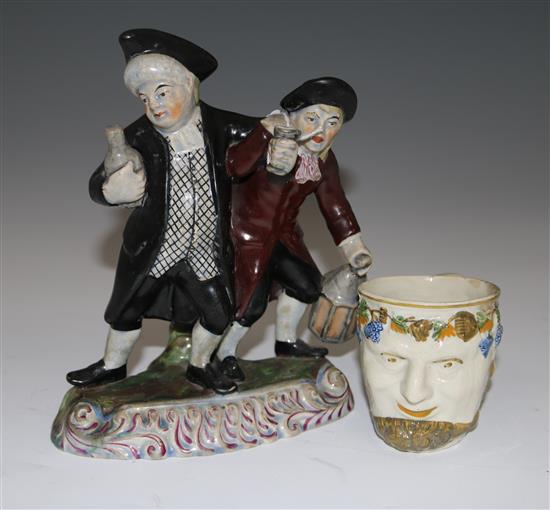 A pearlware Bacchus mug and a Staffordshire style nightwatchman group, 23cm & 9cm (9in. & 3.5in.)